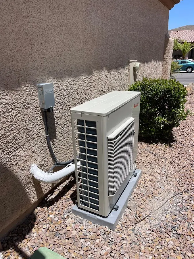 Residential air conditioning condenser unit in Peculiar